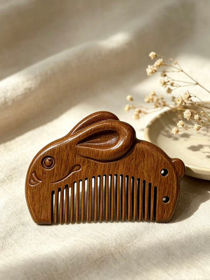 Rabbit Comb on fabric with dried flowers
