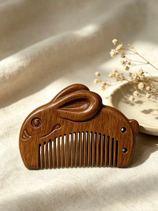 Rabbit Comb on fabric with dried flowers